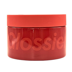 Glossier Creme de You body butter tub closeup showing rich, fast-absorbing texture.
