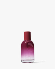 Glossier You Reve bottle with thumbprint indent offering a personalized scent experience.