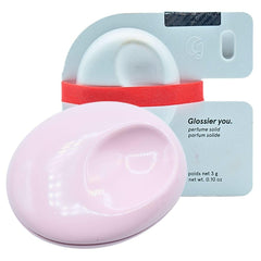 Glossier You Solid compact close-up in pink enamel for portable elegance