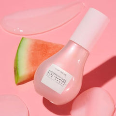 Glow Recipe Watermelon Niacinamide Dew Drops application-on-cheek shows dewy, adaptable makeup primer use.