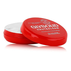 Glysolid glycerin cream jar being used on hands demonstrates easy application.