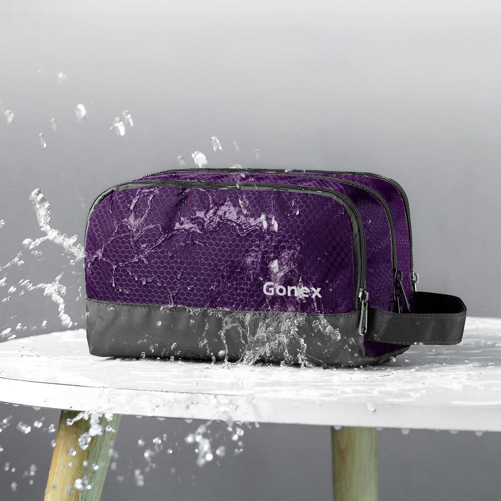 Gonex deep purple bag features zippered mesh pocket for small items