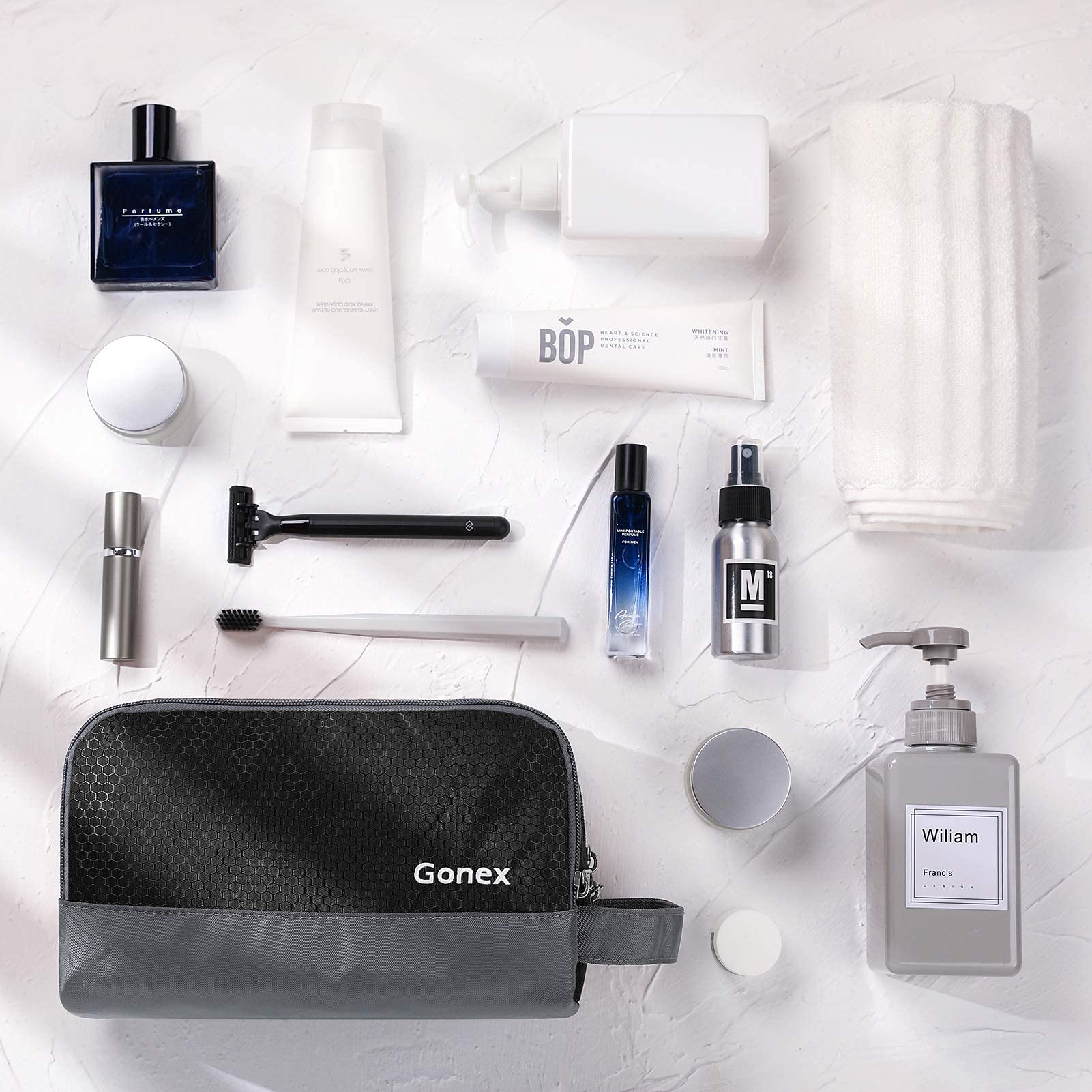Gonex travel toiletry bag nylon black packed compactly fits in a duffel.