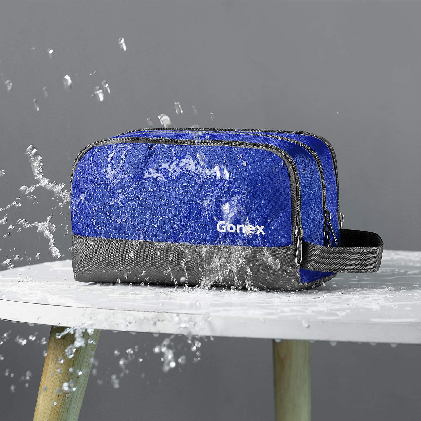 Gonex travel toiletry bag main compartment stores larger items like shampoo