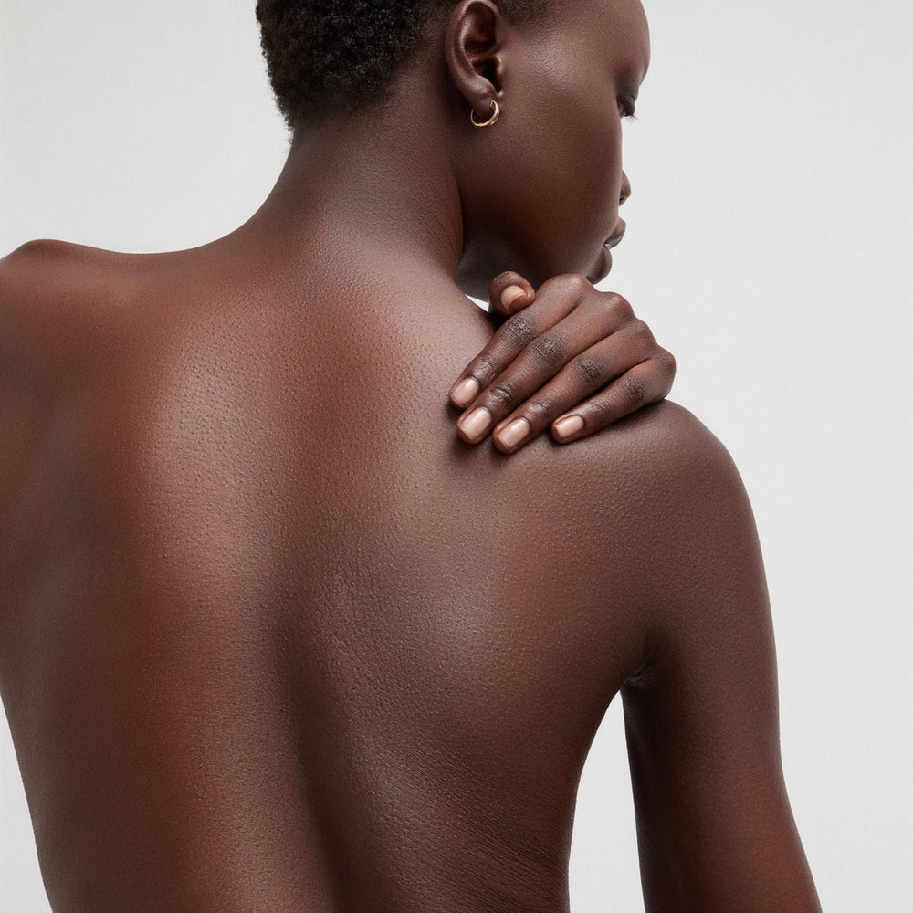 goop Beauty Body Butter application on hands demonstrates smoothing, immediate comfort and improved skin feel