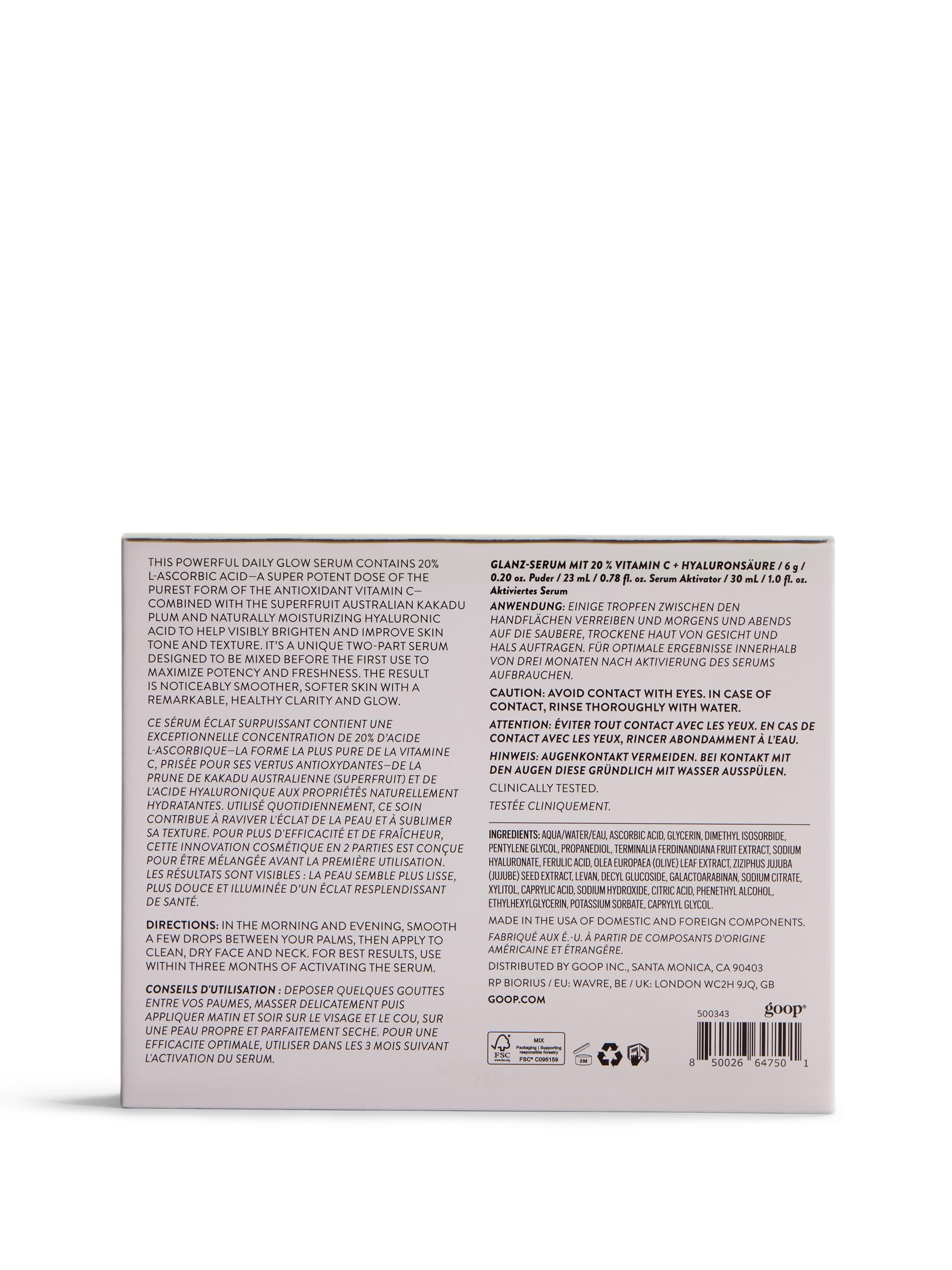 goop bottle close-up with droplet—hydration detail and luxe texture.