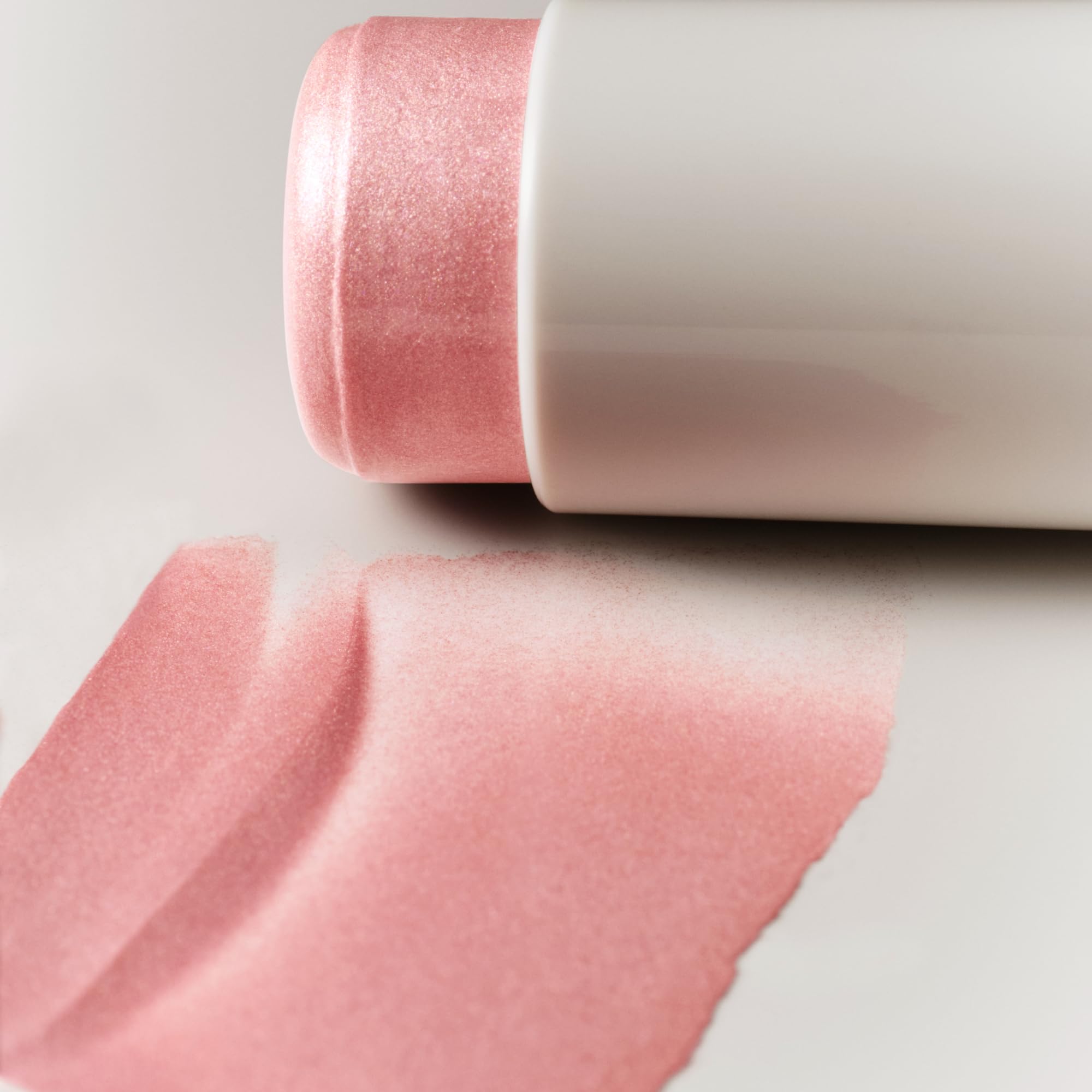 Goop Beauty Glow Skin Highlighter Stick cap shows precise application control.