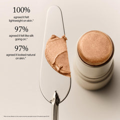 Goop Beauty Glow Skin Highlighter Stick in-use image shows easy blend with fingertips.