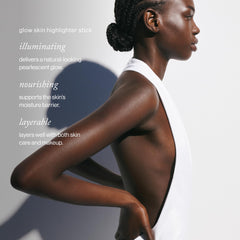 Goop Beauty Glow Skin Highlighter Stick swatch on cheeks demonstrates natural highlight.