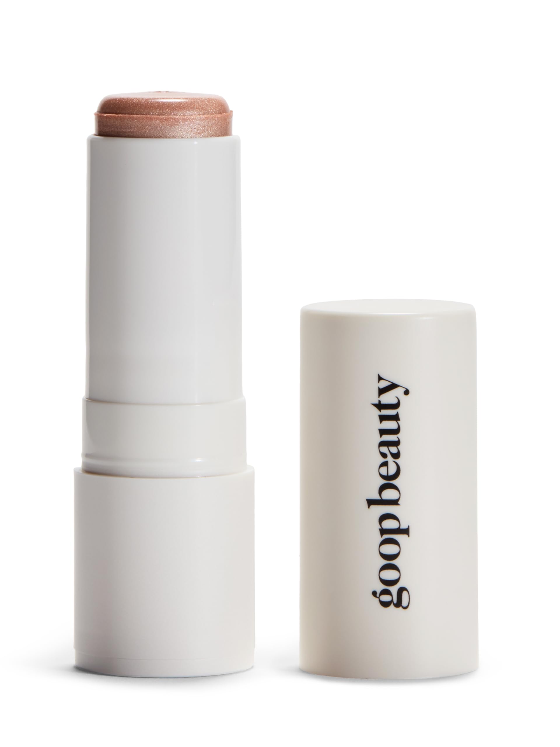 Goop Beauty Glow Skin Highlighter Stick texture closeup shows pearlescent glow on skin.