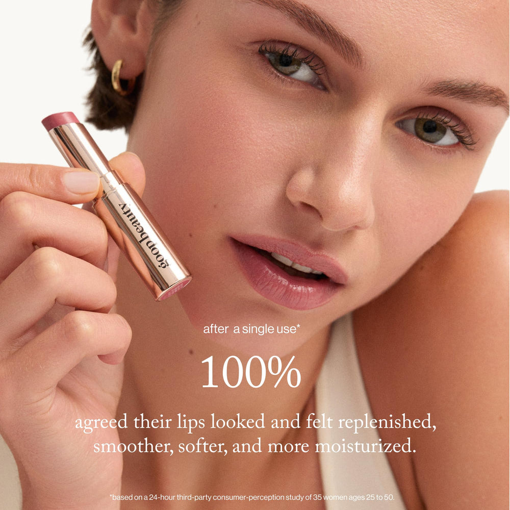 goop Beauty tinted lip balm tube closeup for portable, all-day lip hydration.