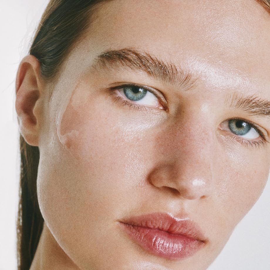 goop Exosome Hydration Serum on face and neck during morning routine