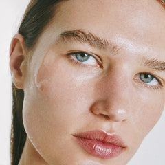 goop Exosome Hydration Serum on face and neck during morning routine