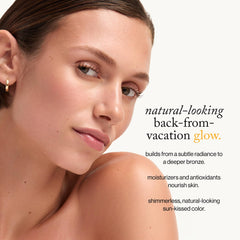 goop Summertone Bronzing Gel swirled on cheek for sun-kissed finish.