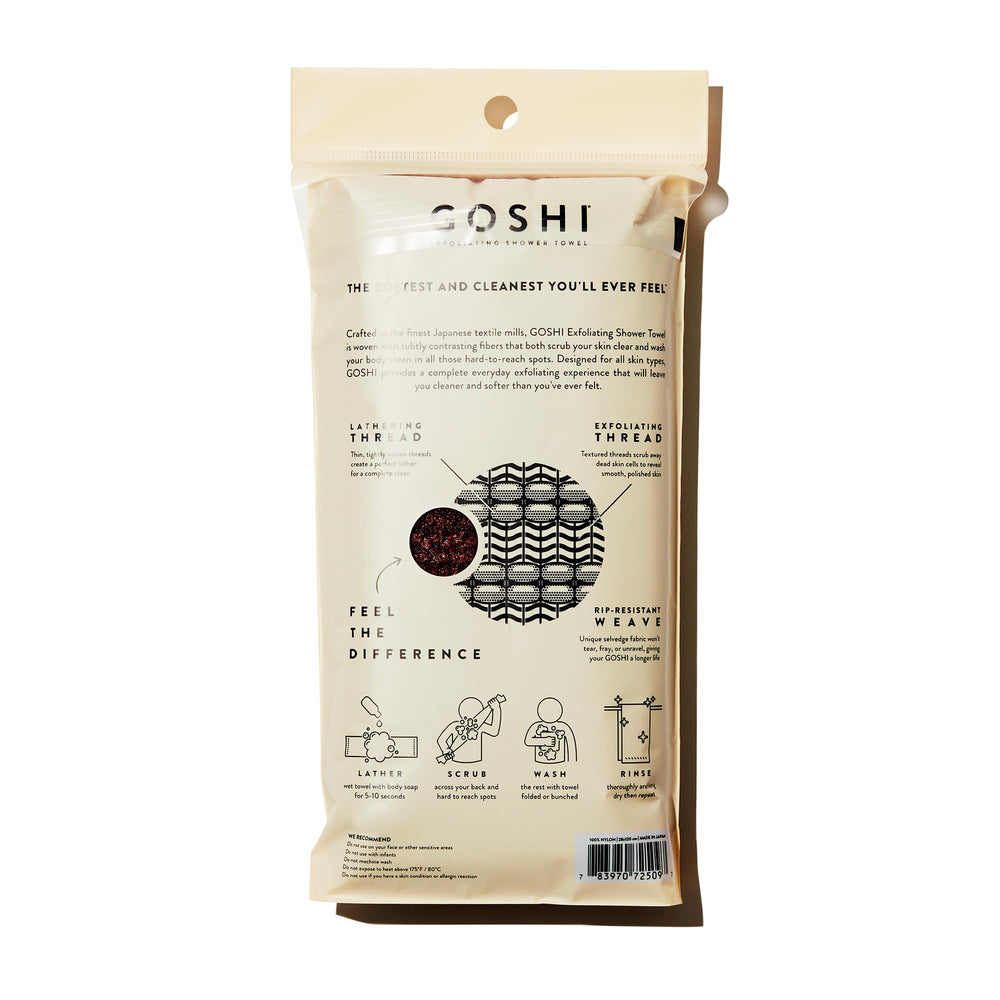 GOSHI exfoliating towel brick-red textured fabric close-up shows dual-thread exfoliation.
