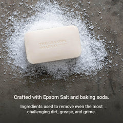 Closeup reveals gritty Epsom salt texture for deeper cleansing with The Grandpa Soap Company.