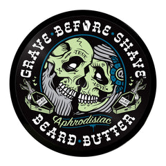 Grave Before Shave beard butter in hand applying to soften beard and soothe skin.