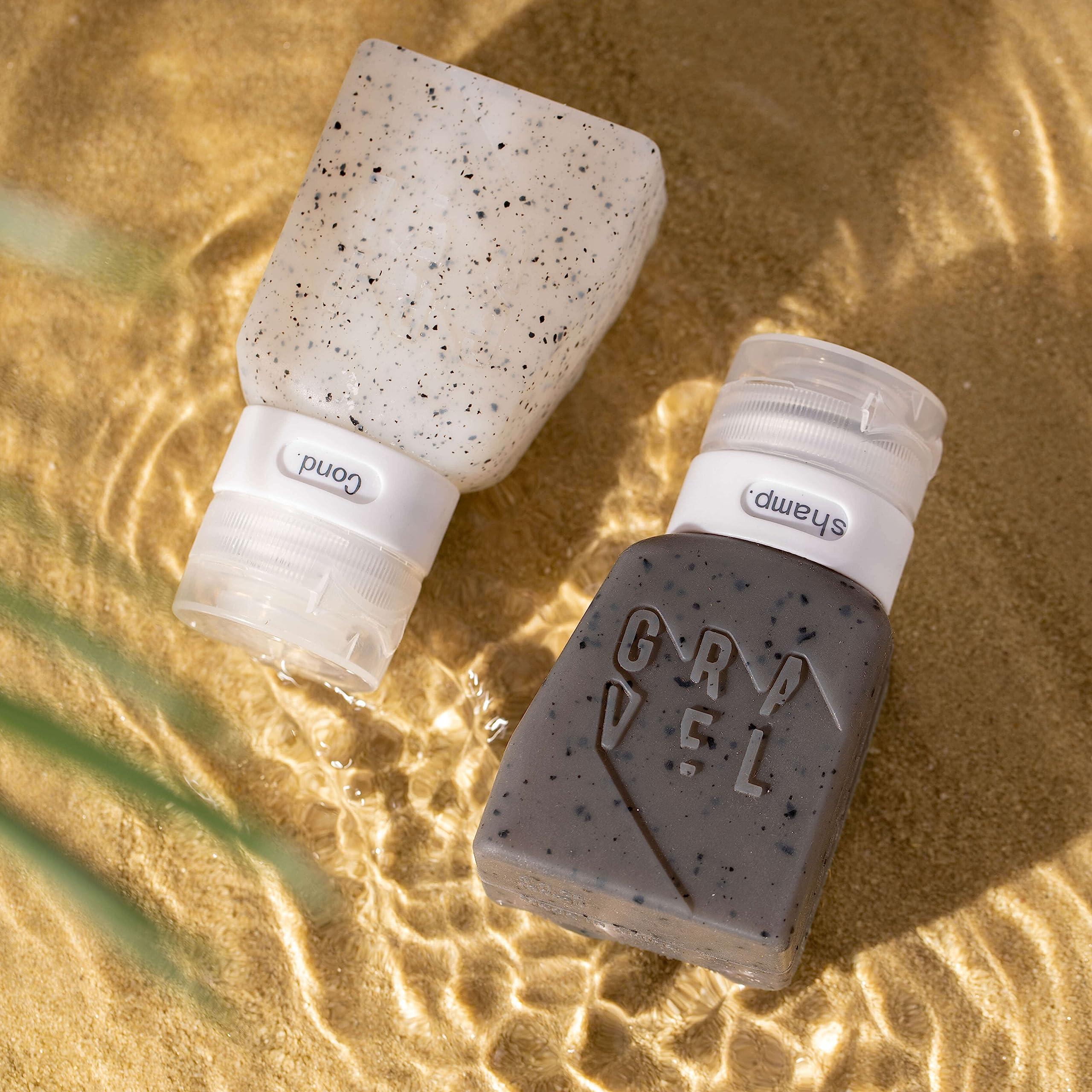 Gravel travel bottles with leakproof design shown in a packed bag