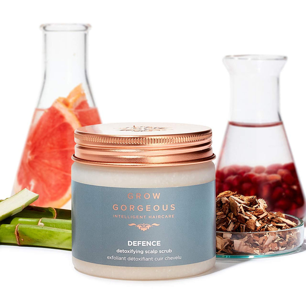 Grow Gorgeous scrub being massaged into scalp showing cleansing action