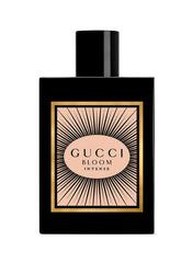 Gucci Bloom Intense cap closeup showing elegant packaging and premium fragrance