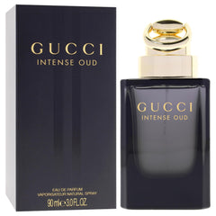 Close-up of Gucci Intense Oud bottle with ornate wooden cap