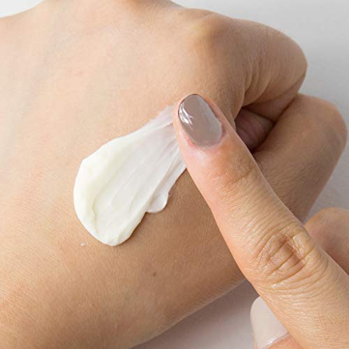 Guerisson 9 Complex Cream on skin shows instant absorption and dewy glow.