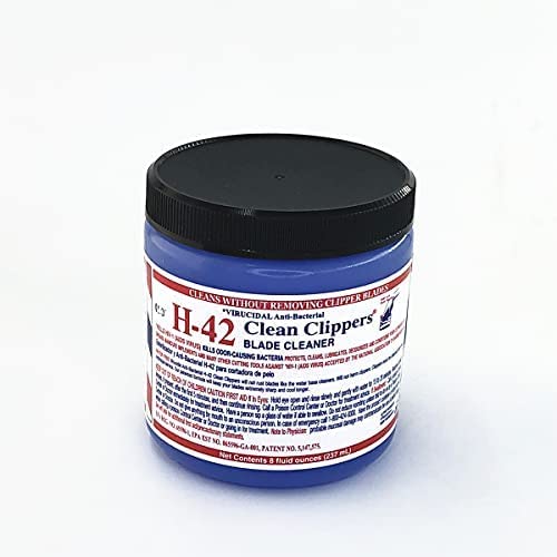 H-42 Clean Clippers Blade Cleaner spray application demonstrates quick disinfection between grooming sessions