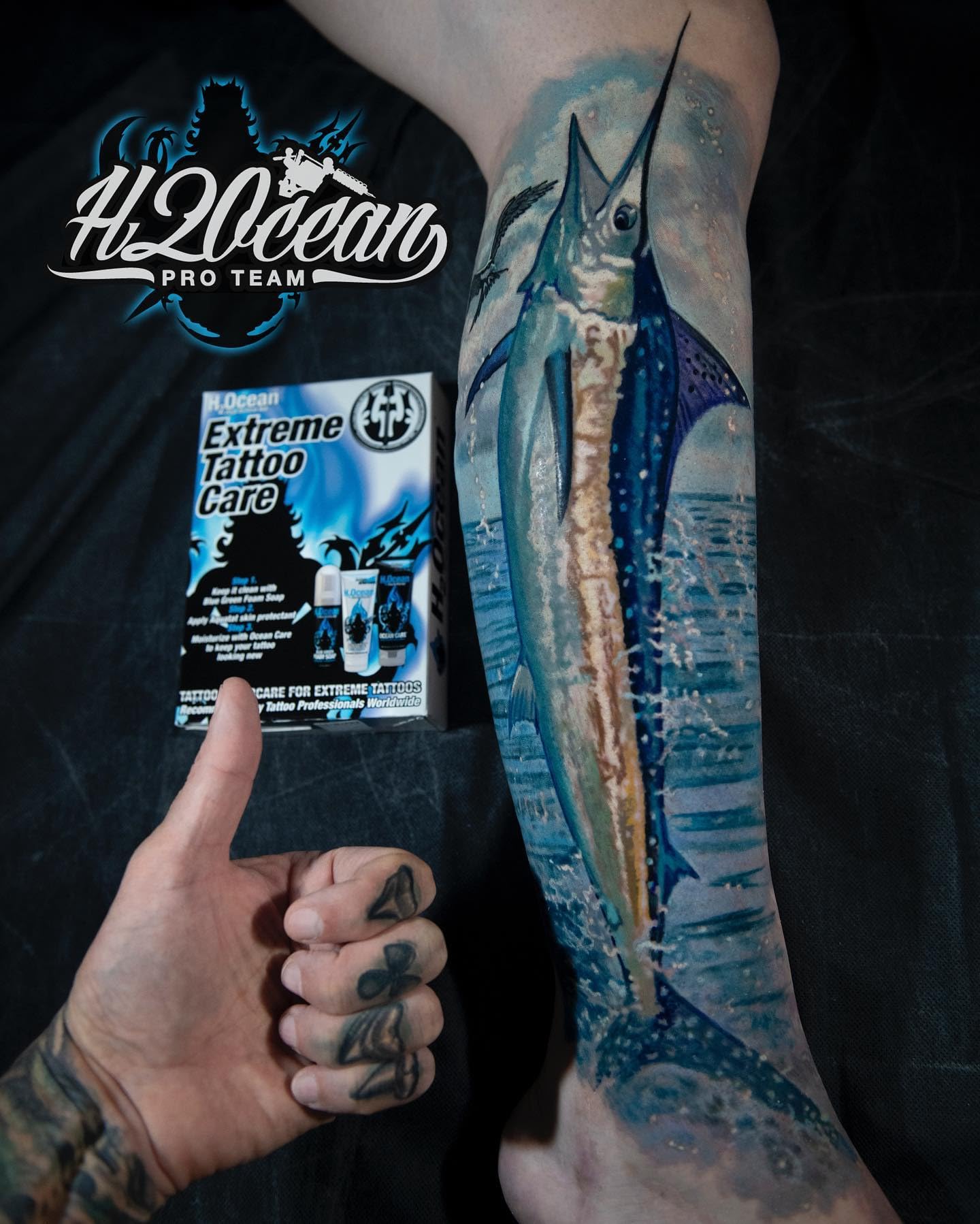 H2Ocean Aquatat applying ointment to skin for pre-, during, and post-tattoo care.