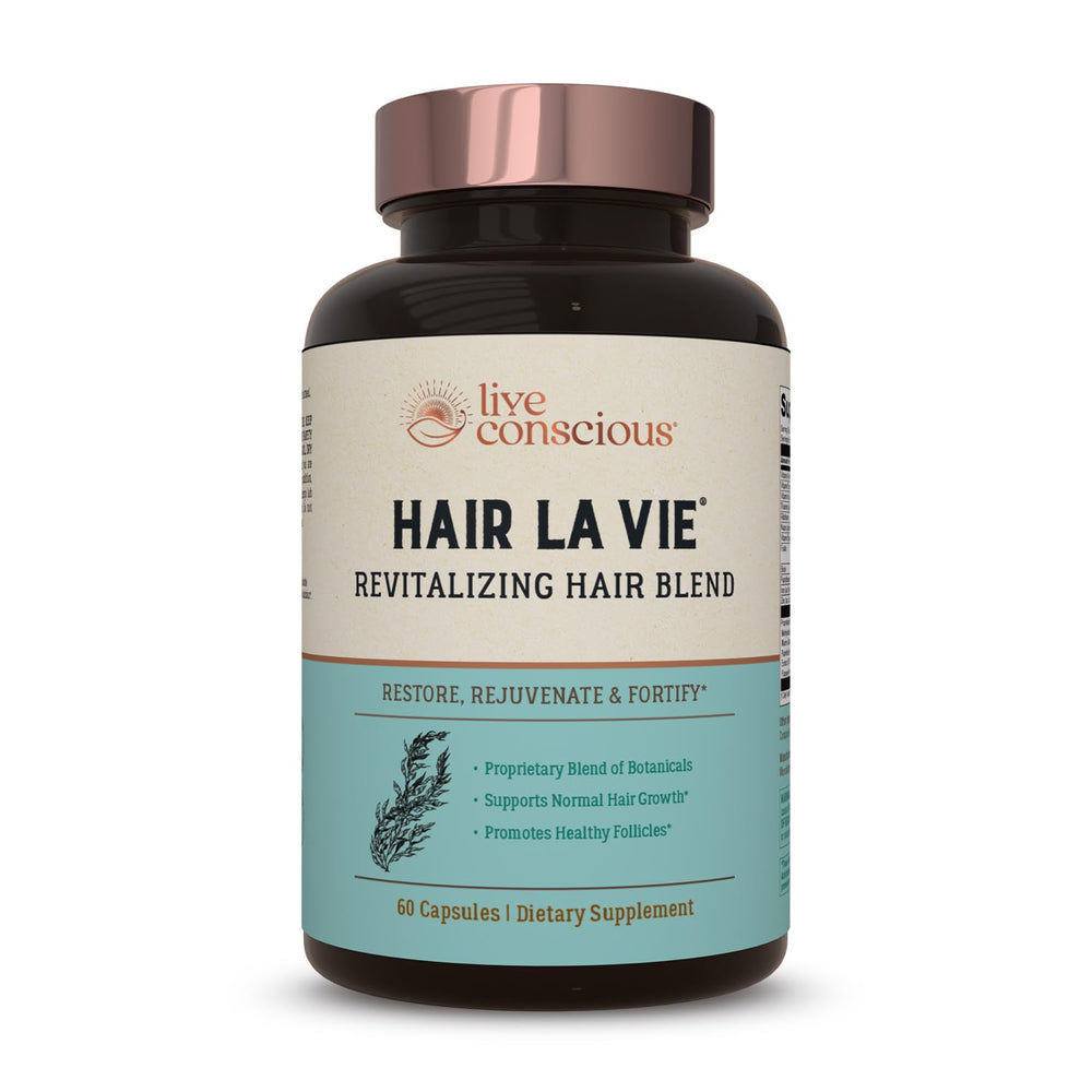 Hair La Vie Revitalizing Blend bottle front for daily hair health support.