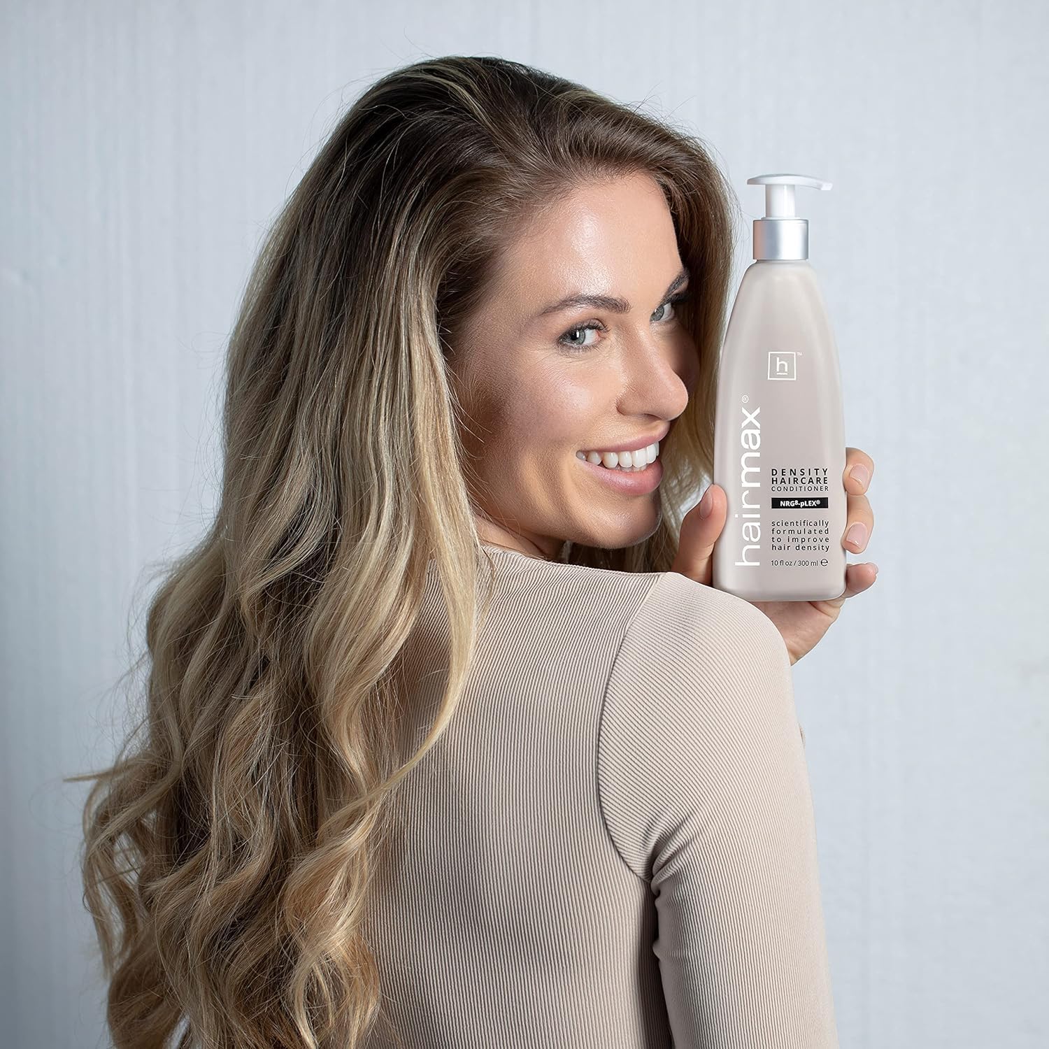Hairmax Density science-lab scene conveys ongoing research behind product.