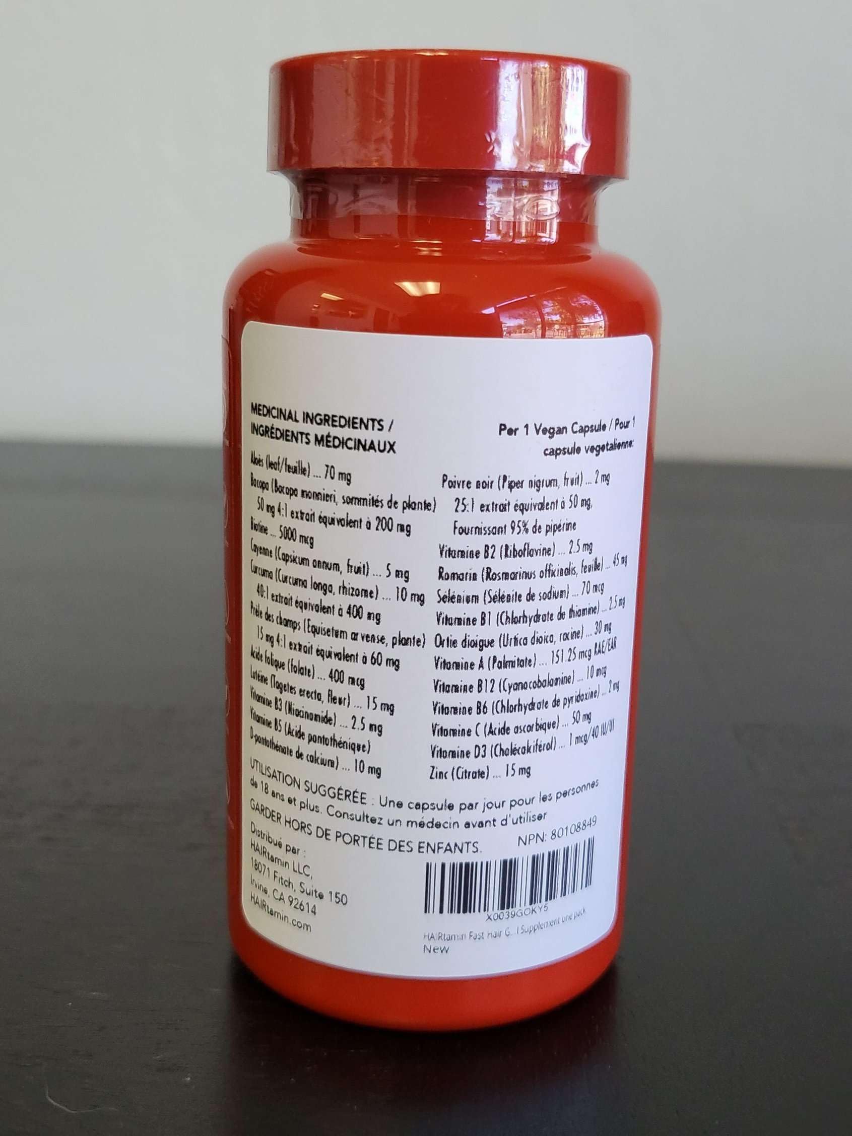 HAIRtamin glass bottle on desk—easy to add into daily routines