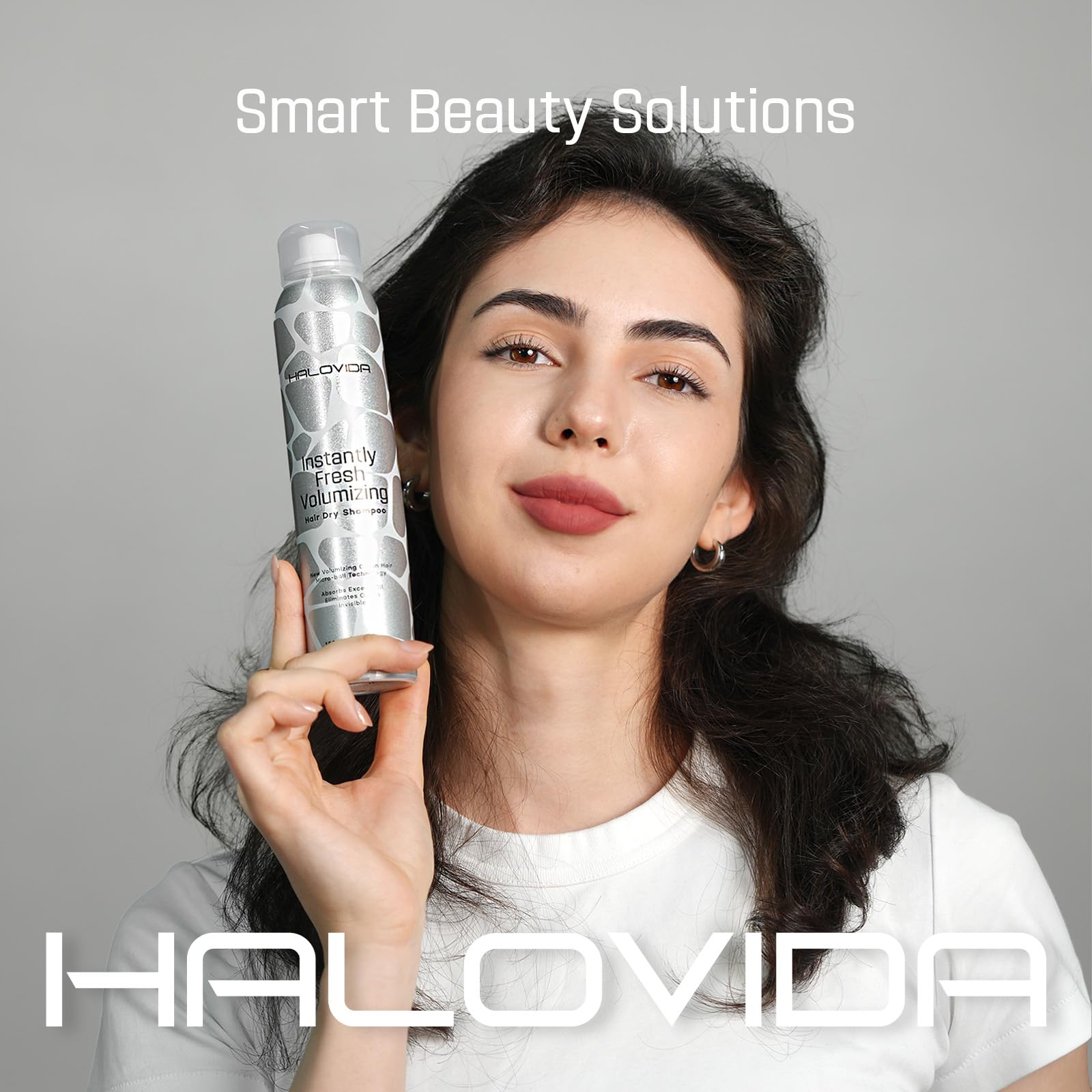 HALOVIDA dry shampoo dispense bottle demonstrates even spray distribution for long-lasting volume.