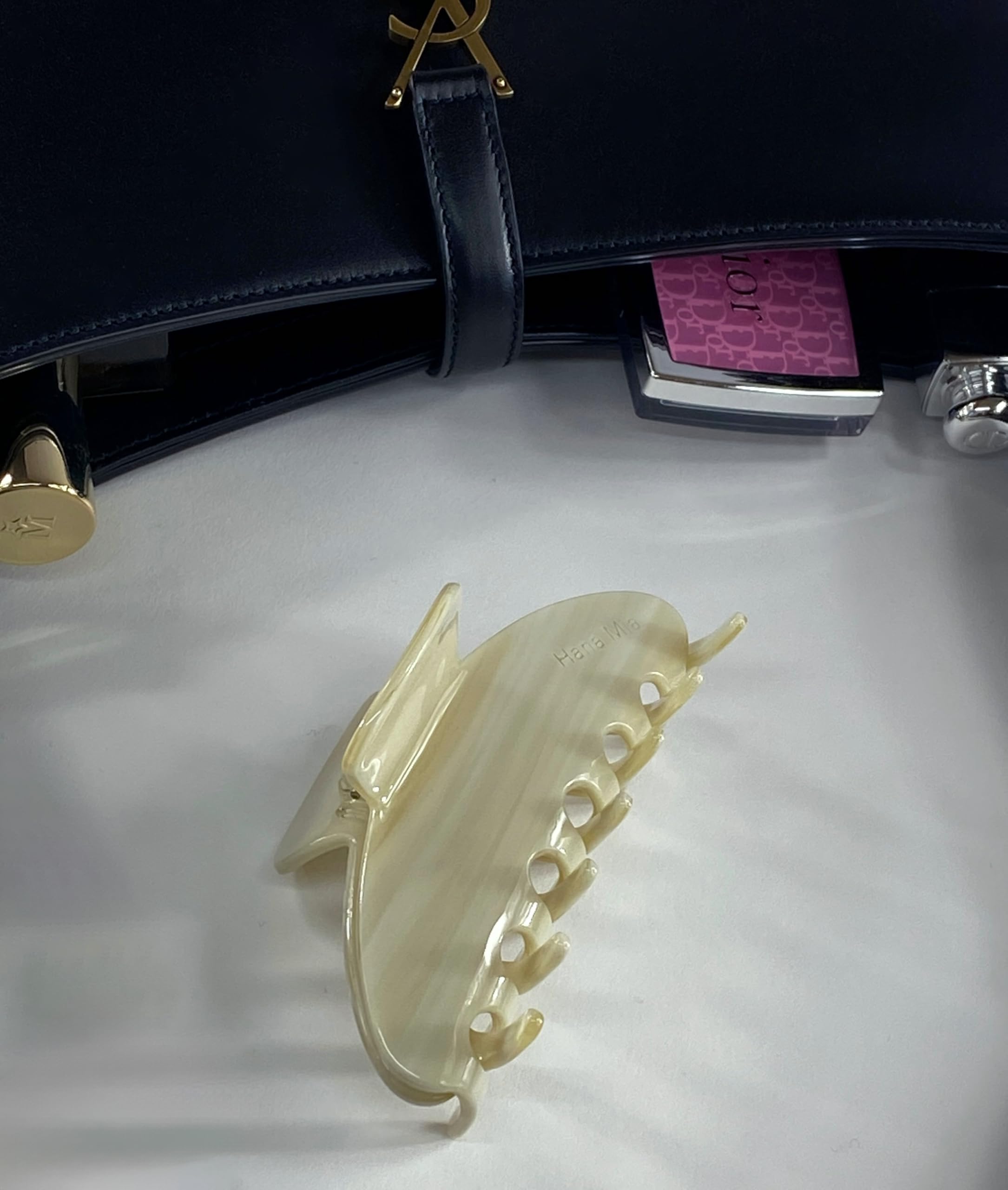 Hana Mia creme clip easily fits a purse for on-the-go touch-ups