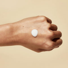 Hanacure Nano Emulsion glow-on-skin shot suggests radiant, dewy finish without heaviness.