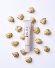Hanalei Lip Treatment packaging on display highlighting compact travel size.