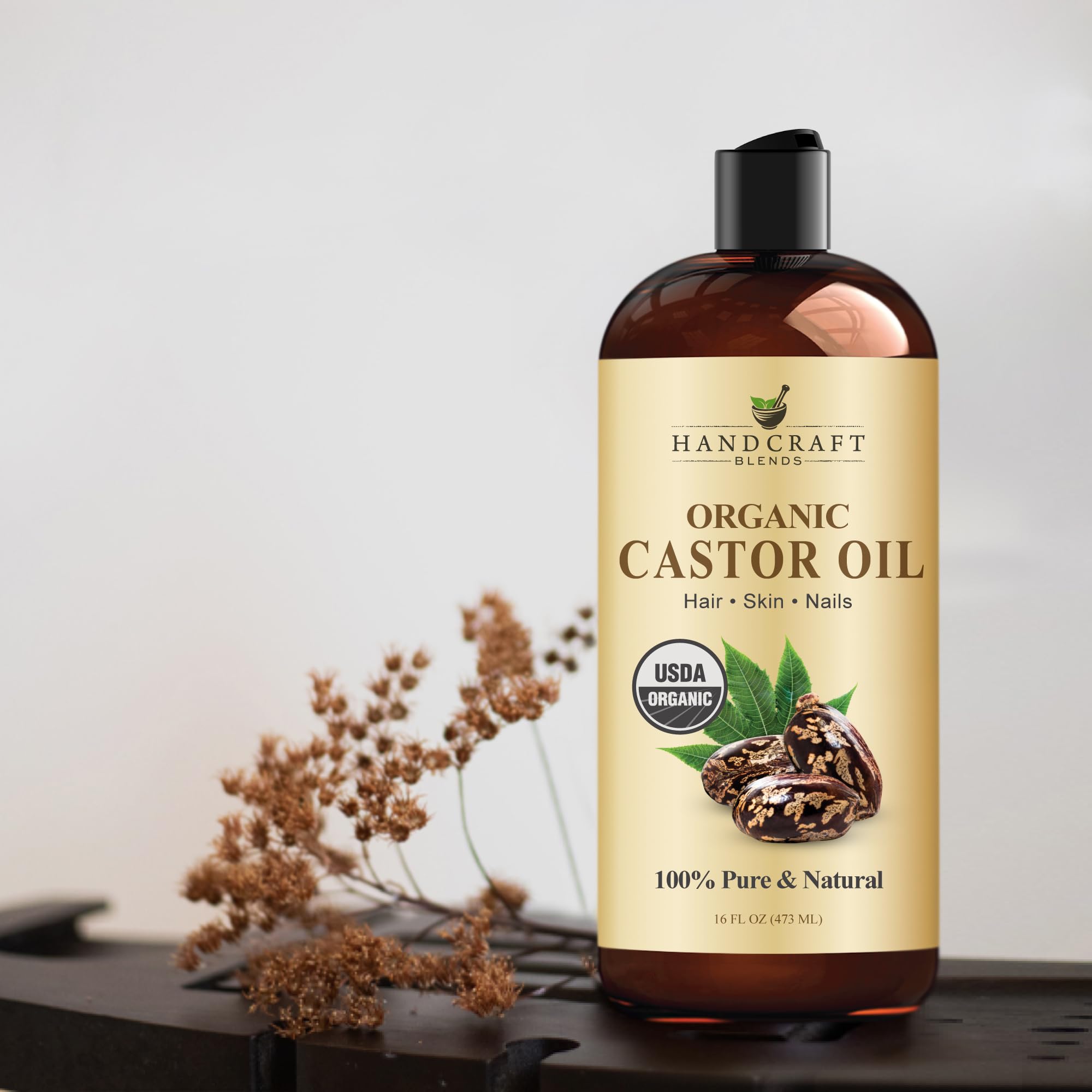 Handcraft Blends castor oil bottle beside measuring spoon illustrating generous 16 fl oz supply