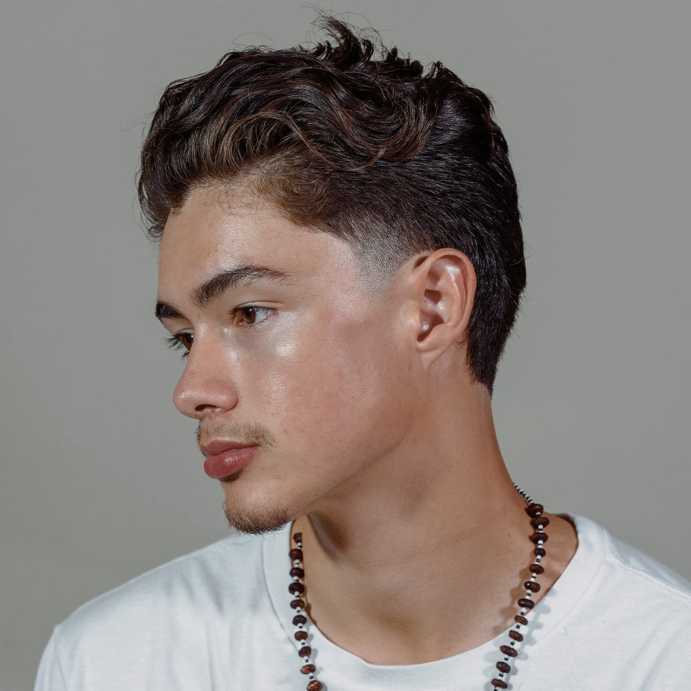 Hanz de Fuko Hybridized Wax applied to damp hair for smooth looks.