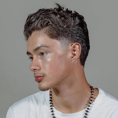 Hanz de Fuko Hybridized Wax applied to dry hair for lasting texture.