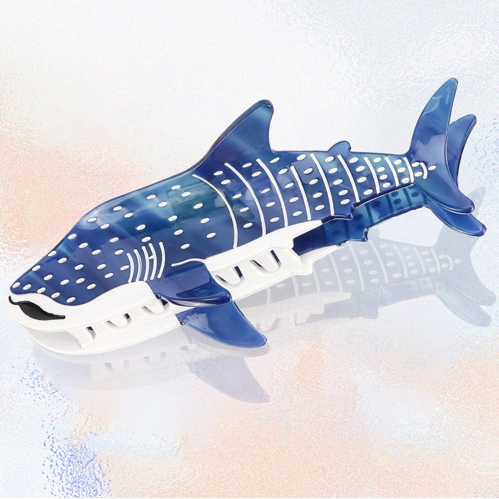 Hapdoo dark blue shark hair clip held for display with elegant nautical vibe