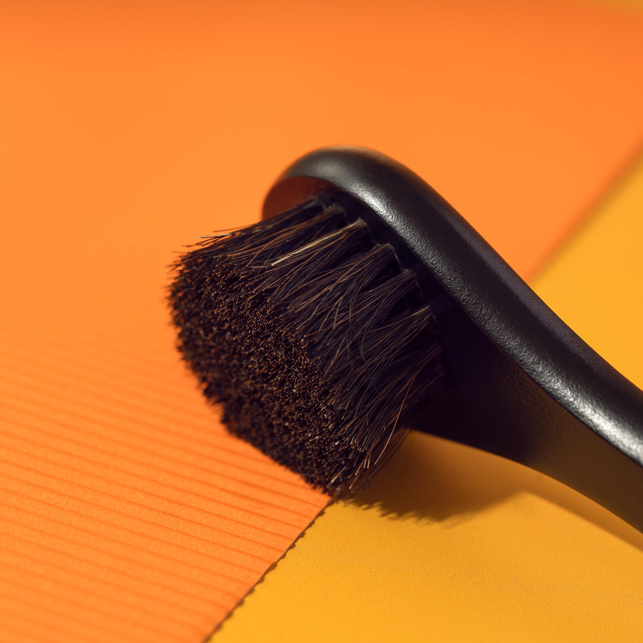 Happy Sol brush bristles in action showing natural horsehair texture for skin smoothing.