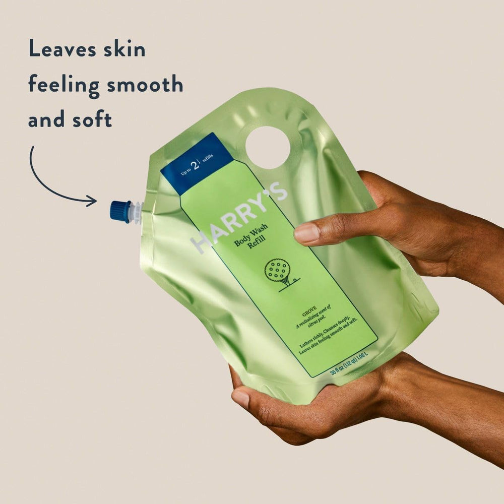 Harry's Grove scent refill topping up the body wash pump for easy daily use.