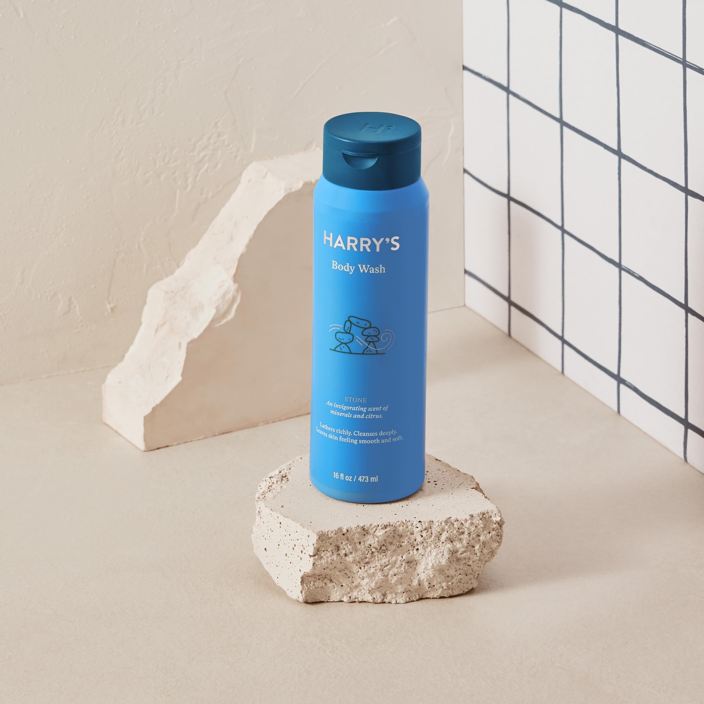 Harry's Men's Body Wash Stone user holding bottle for daily shower routine