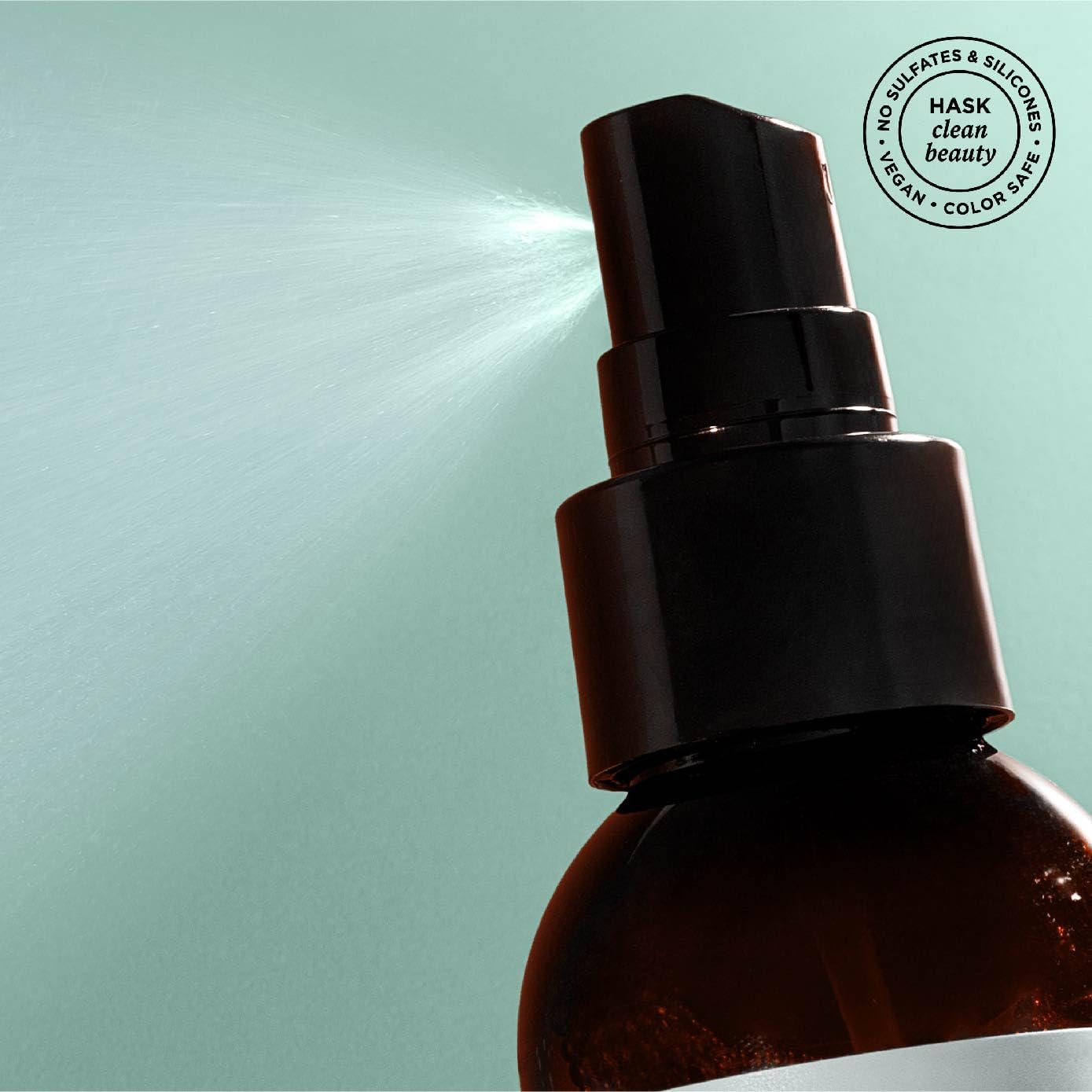 HASK Invigorating Tea Tree Oil Leave-In bottle label close-up on color-safe formula