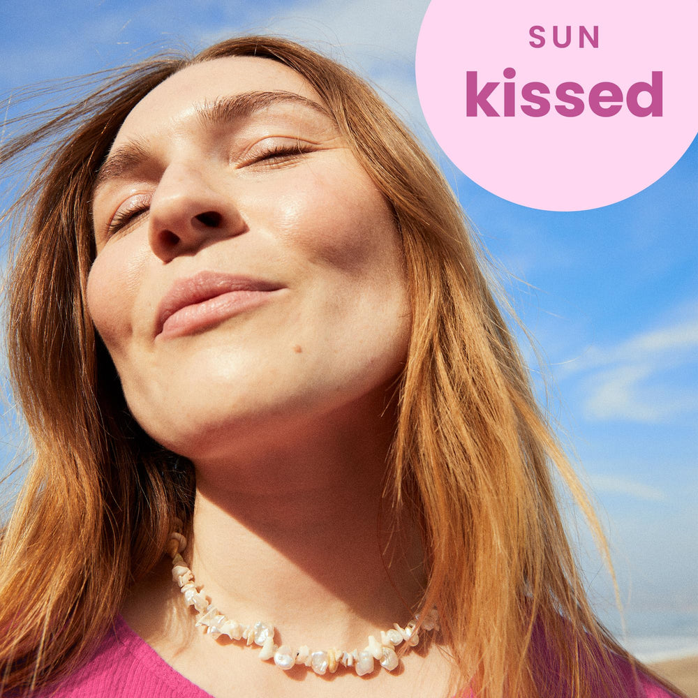 Hawaiian Tropic Tropical Lip Balm SPF 30 in use on lips outdoors