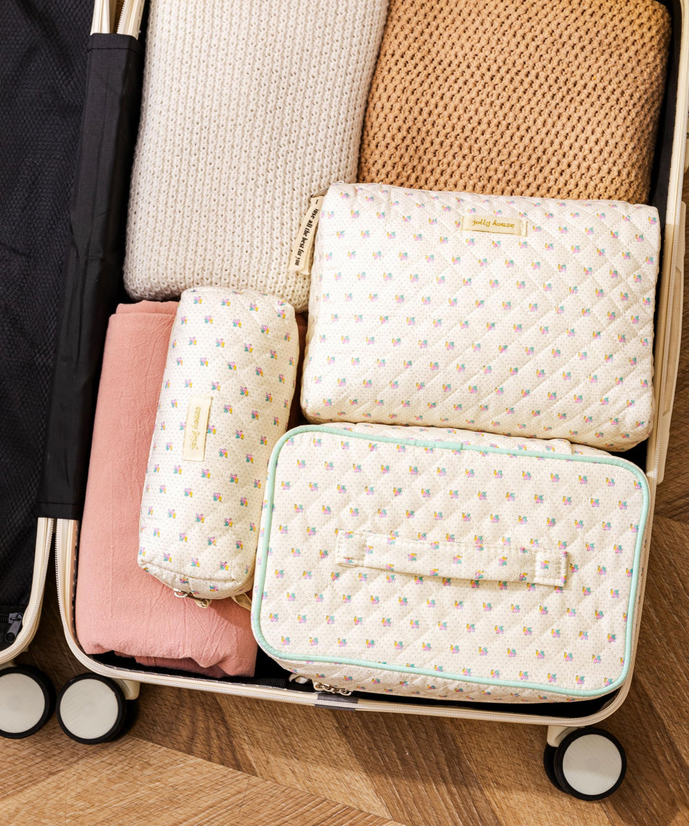HBselect makeup bag large capacity front view holding cosmetics and brushes.