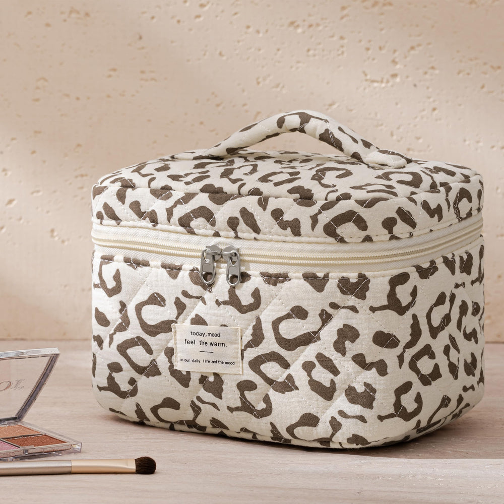 HBselect Quilted Makeup Bag inside-contents shows spacious interior for skincare and makeup