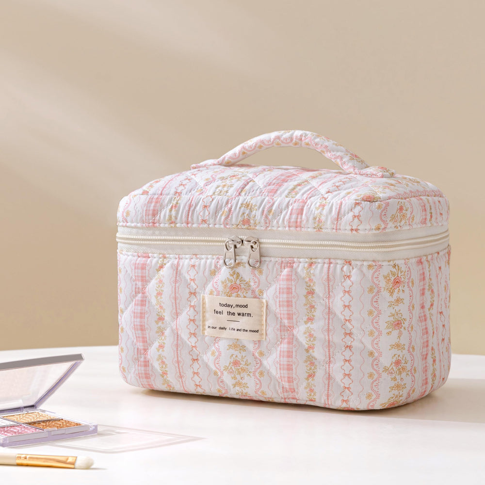 HBselect quilted makeup bag travel setup staged with essentials, illustrating portability.