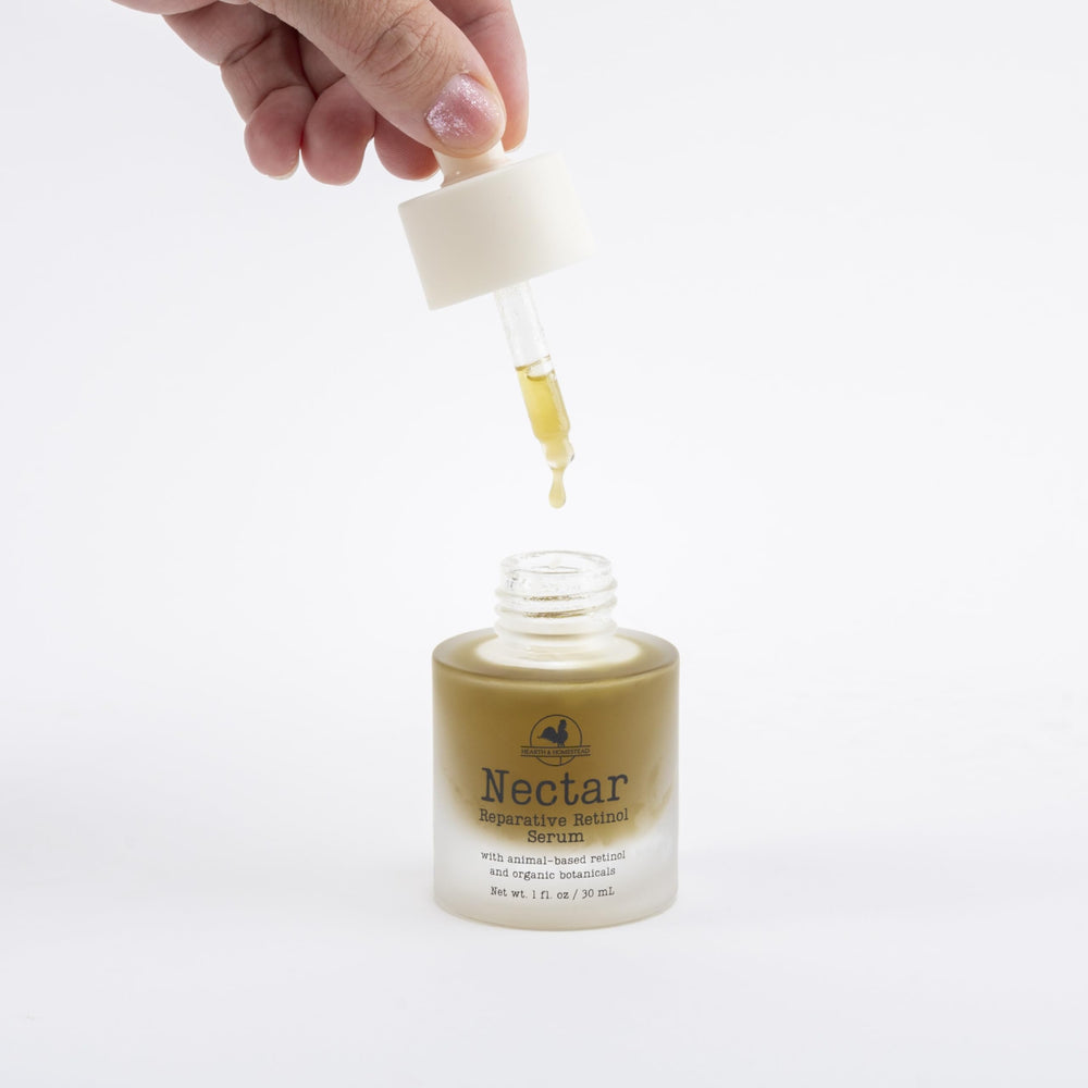 Hearth and Homestead Nectar serum ingredients close-up highlight cod liver oil and emu oil for nourishment.