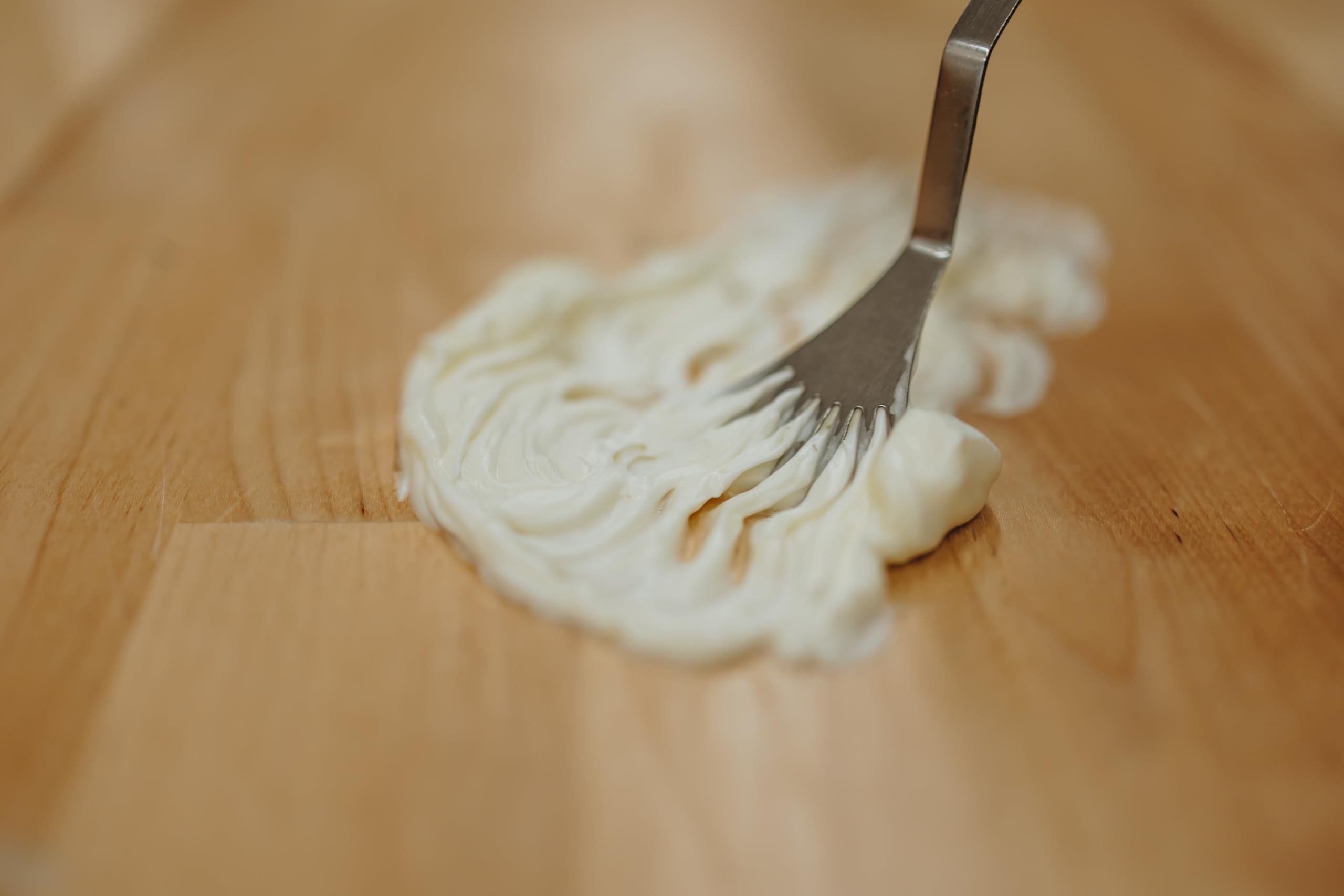 Hearth and Homestead balm texture closeup highlights whipped, melt-in moisture for everyday use.