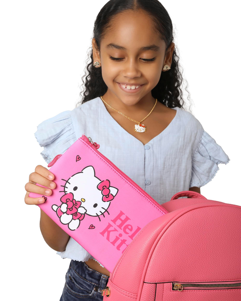 Hello Kitty makeup bag top zip closure secures cosmetics on the go.